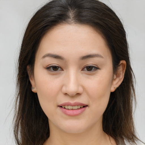 Joyful white young-adult female with long  brown hair and brown eyes