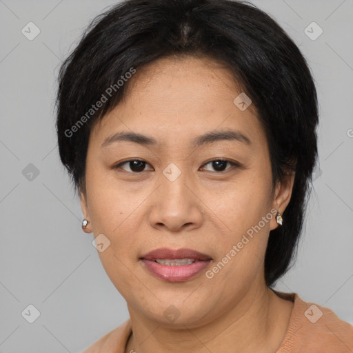 Joyful asian adult female with short  brown hair and brown eyes