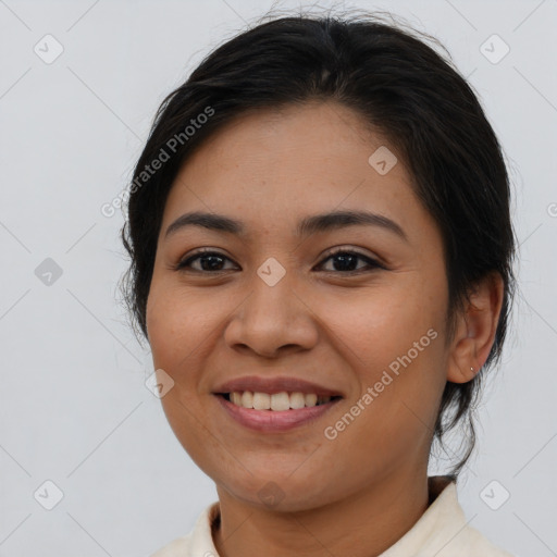 Joyful asian young-adult female with medium  brown hair and brown eyes