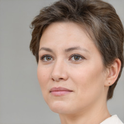 Joyful white adult female with short  brown hair and brown eyes