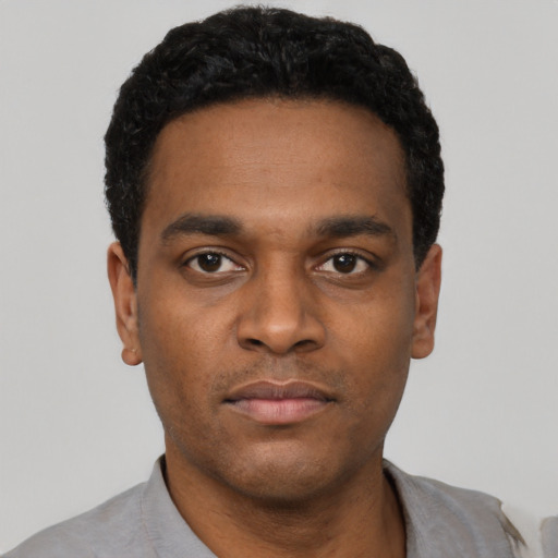 Neutral black young-adult male with short  black hair and brown eyes