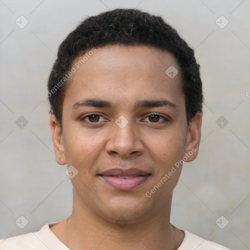 Joyful latino young-adult male with short  brown hair and brown eyes