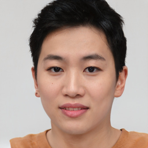 Joyful asian young-adult female with short  black hair and brown eyes