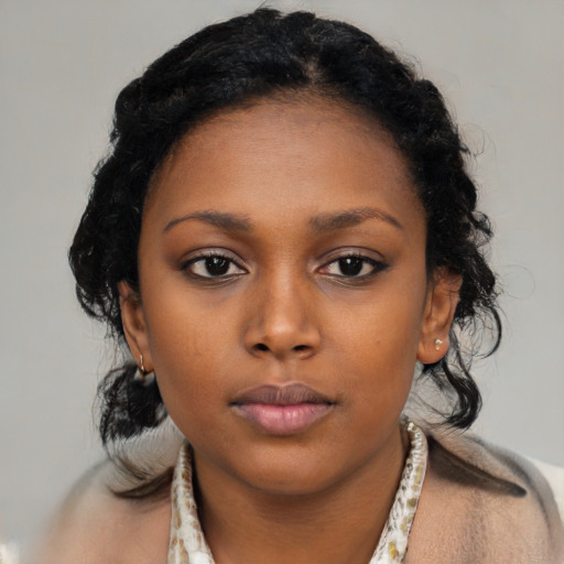 Neutral black young-adult female with long  brown hair and brown eyes