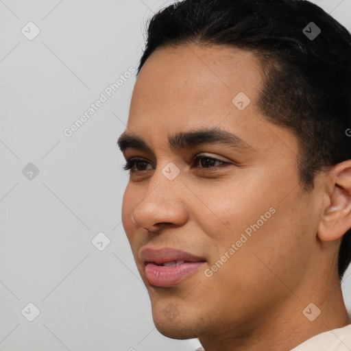 Joyful white young-adult male with short  black hair and brown eyes