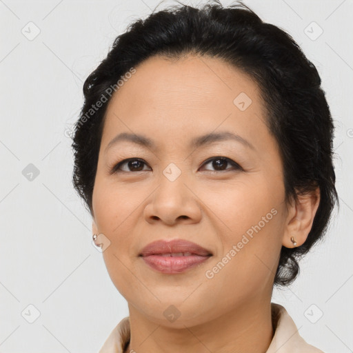 Joyful asian adult female with medium  brown hair and brown eyes