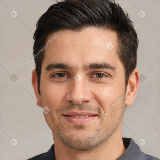 Joyful white adult male with short  black hair and brown eyes