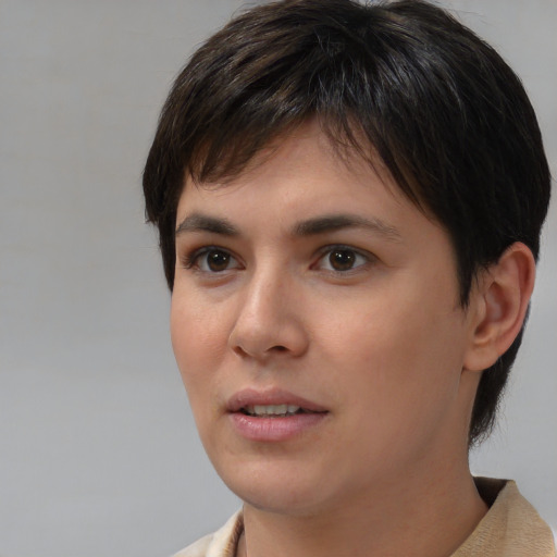 Joyful white young-adult female with short  brown hair and brown eyes