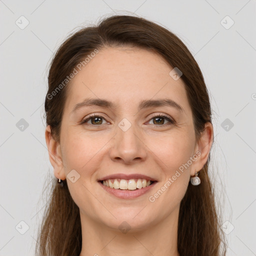 Joyful white young-adult female with long  brown hair and grey eyes