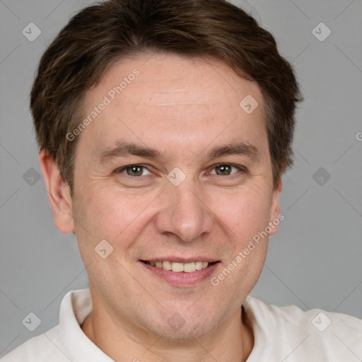 Joyful white adult male with short  brown hair and grey eyes