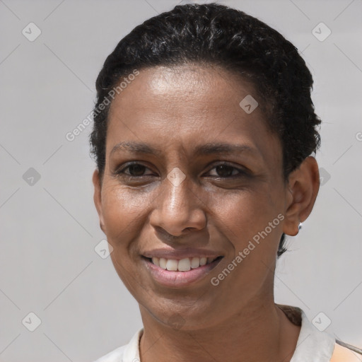 Joyful black adult female with short  brown hair and brown eyes