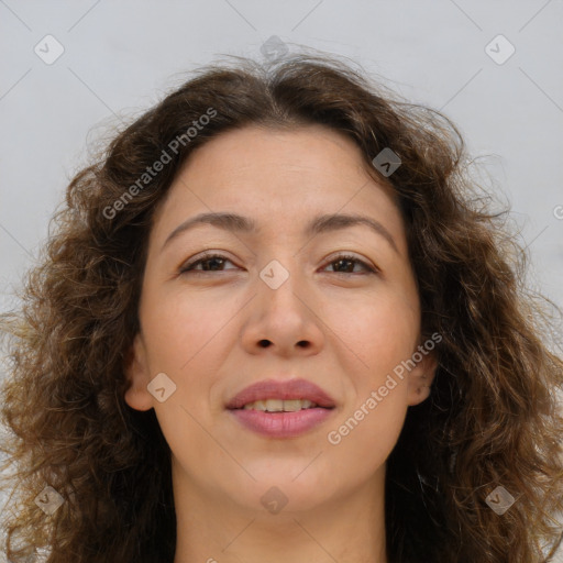 Joyful white adult female with long  brown hair and brown eyes