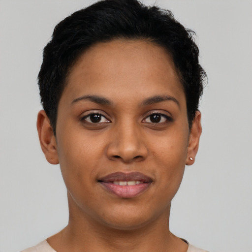 Joyful latino young-adult female with short  brown hair and brown eyes