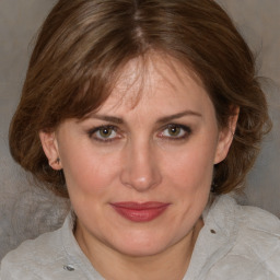 Joyful white adult female with medium  brown hair and brown eyes