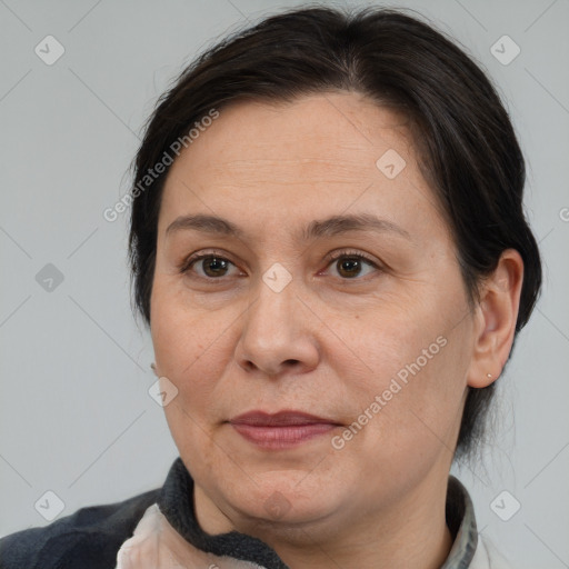 Joyful white adult female with short  brown hair and brown eyes