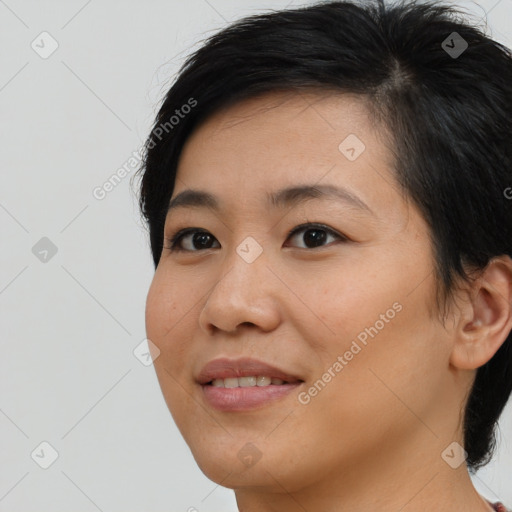 Joyful latino young-adult female with medium  brown hair and brown eyes