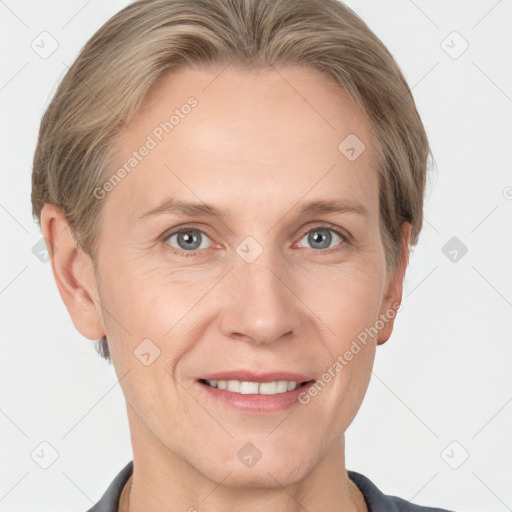 Joyful white adult female with short  brown hair and grey eyes