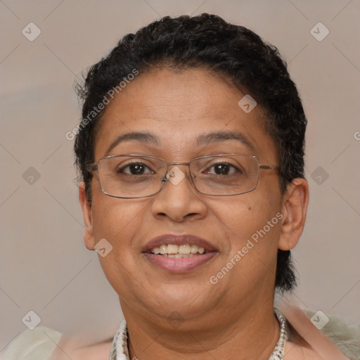 Joyful latino adult female with short  brown hair and brown eyes