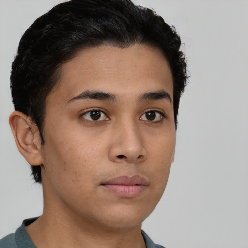 Neutral latino young-adult male with short  brown hair and brown eyes
