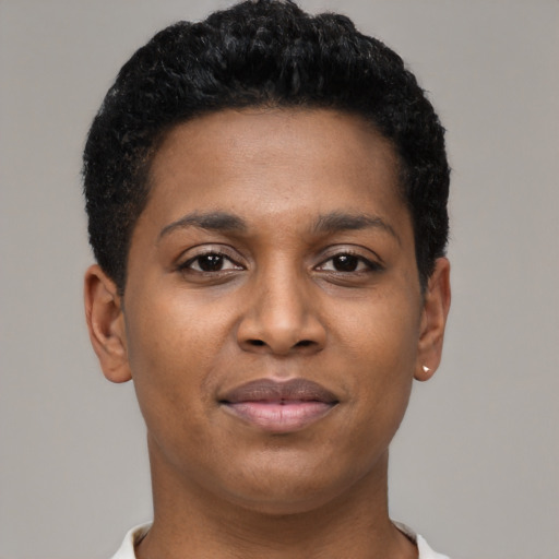 Joyful black young-adult female with short  black hair and brown eyes