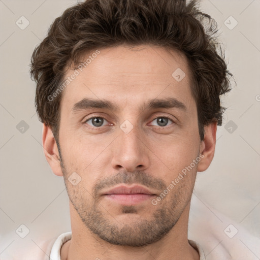 Neutral white young-adult male with short  brown hair and brown eyes