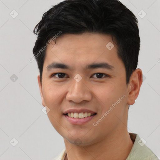 Joyful asian young-adult male with short  black hair and brown eyes