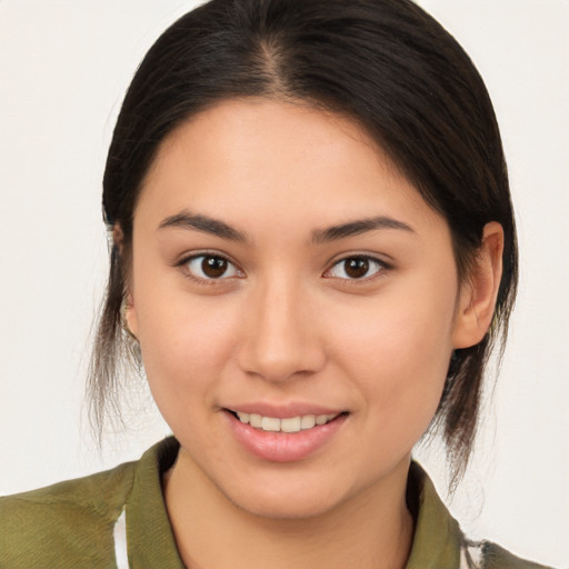 Joyful white young-adult female with medium  brown hair and brown eyes