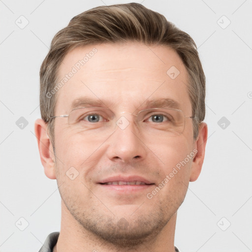 Joyful white adult male with short  brown hair and grey eyes