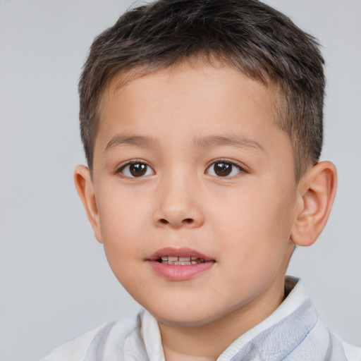 Joyful white child male with short  brown hair and brown eyes