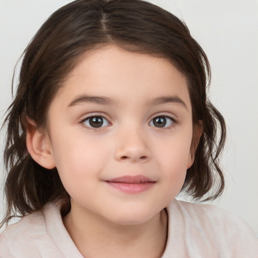 Joyful white child female with medium  brown hair and brown eyes