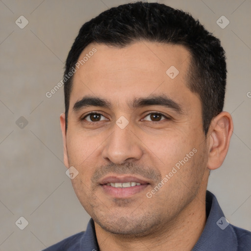 Joyful white young-adult male with short  black hair and brown eyes