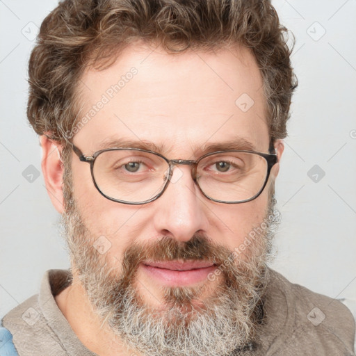 Joyful white adult male with short  brown hair and grey eyes