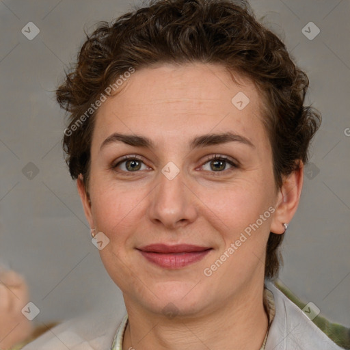 Joyful white adult female with short  brown hair and grey eyes