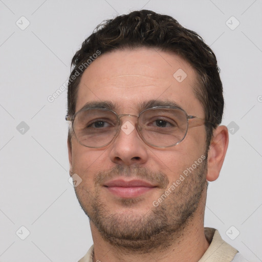 Joyful white adult male with short  brown hair and brown eyes