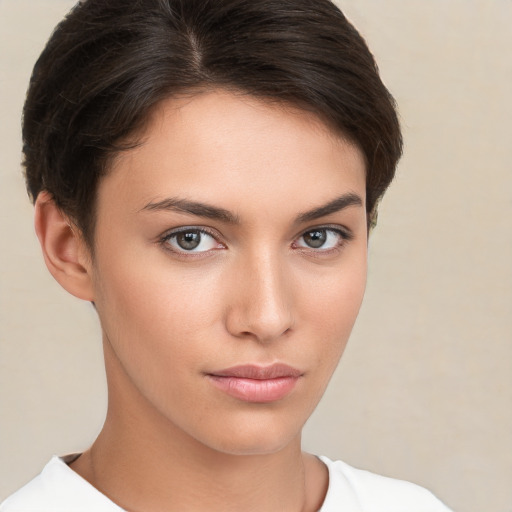 Neutral white young-adult female with short  brown hair and brown eyes