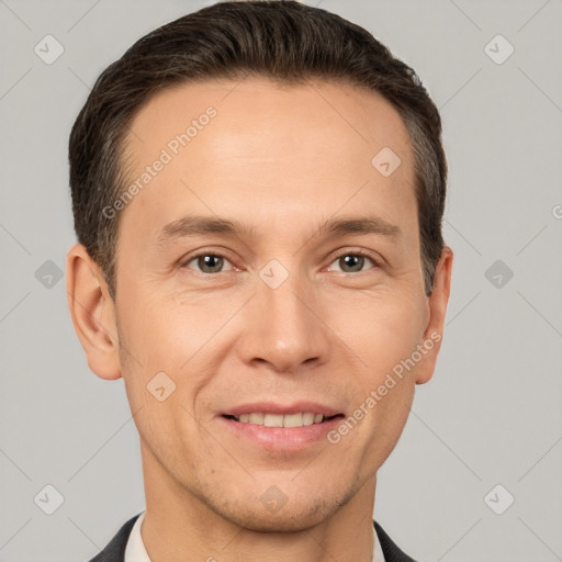 Joyful white adult male with short  brown hair and brown eyes