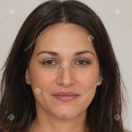 Joyful white adult female with long  brown hair and brown eyes