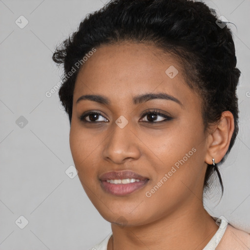 Joyful latino young-adult female with short  black hair and brown eyes