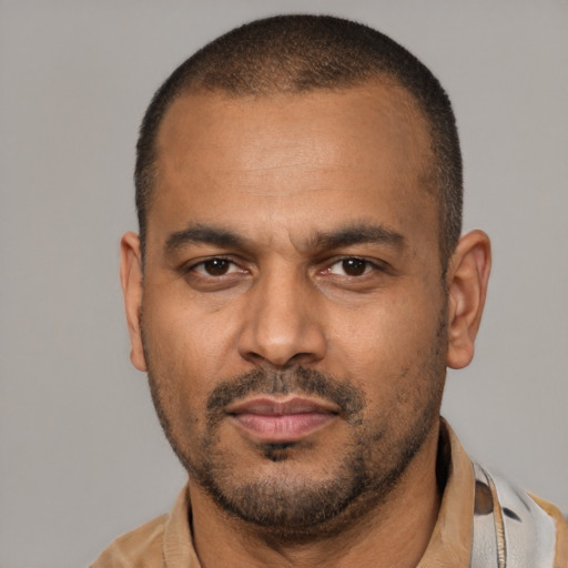 Neutral latino adult male with short  black hair and brown eyes