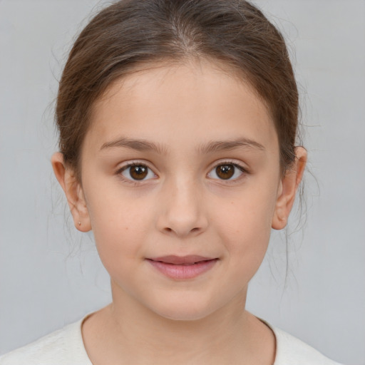 Joyful white child female with medium  brown hair and brown eyes