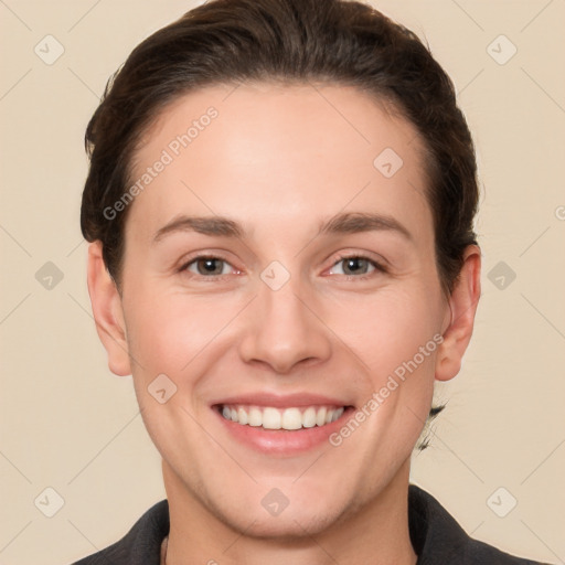 Joyful white young-adult female with short  brown hair and brown eyes