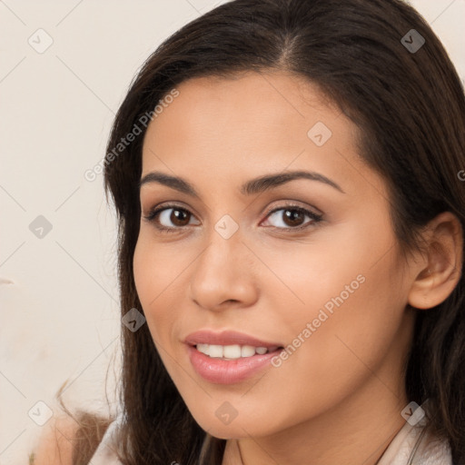 Joyful white young-adult female with long  brown hair and brown eyes