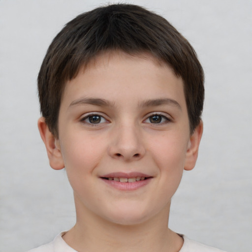 Joyful white child female with short  brown hair and brown eyes