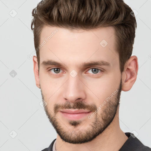 Neutral white young-adult male with short  brown hair and grey eyes