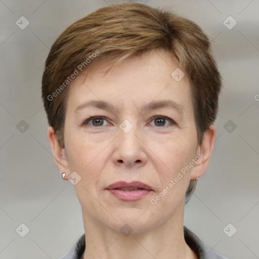 Joyful white adult female with short  brown hair and grey eyes