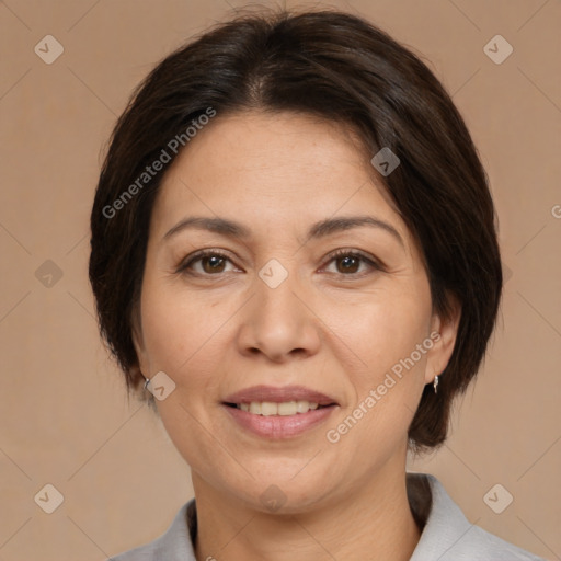 Joyful white adult female with medium  brown hair and brown eyes