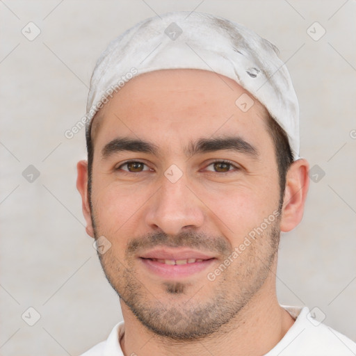 Joyful white young-adult male with short  black hair and brown eyes