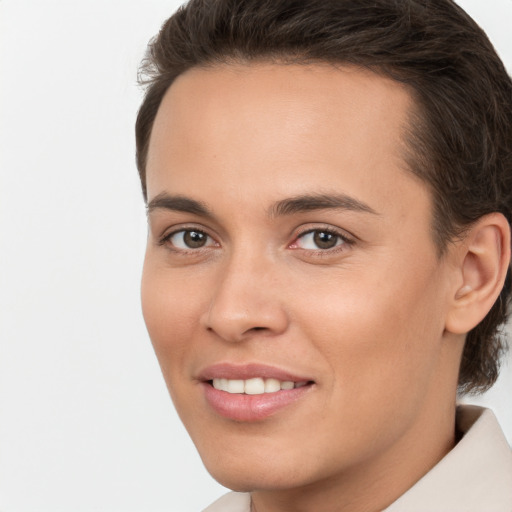 Joyful white young-adult female with short  brown hair and brown eyes