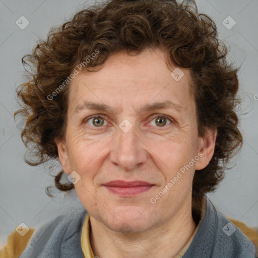 Joyful white adult female with medium  brown hair and blue eyes