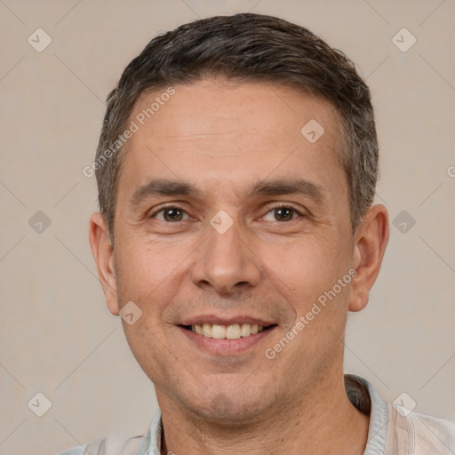 Joyful white adult male with short  brown hair and brown eyes